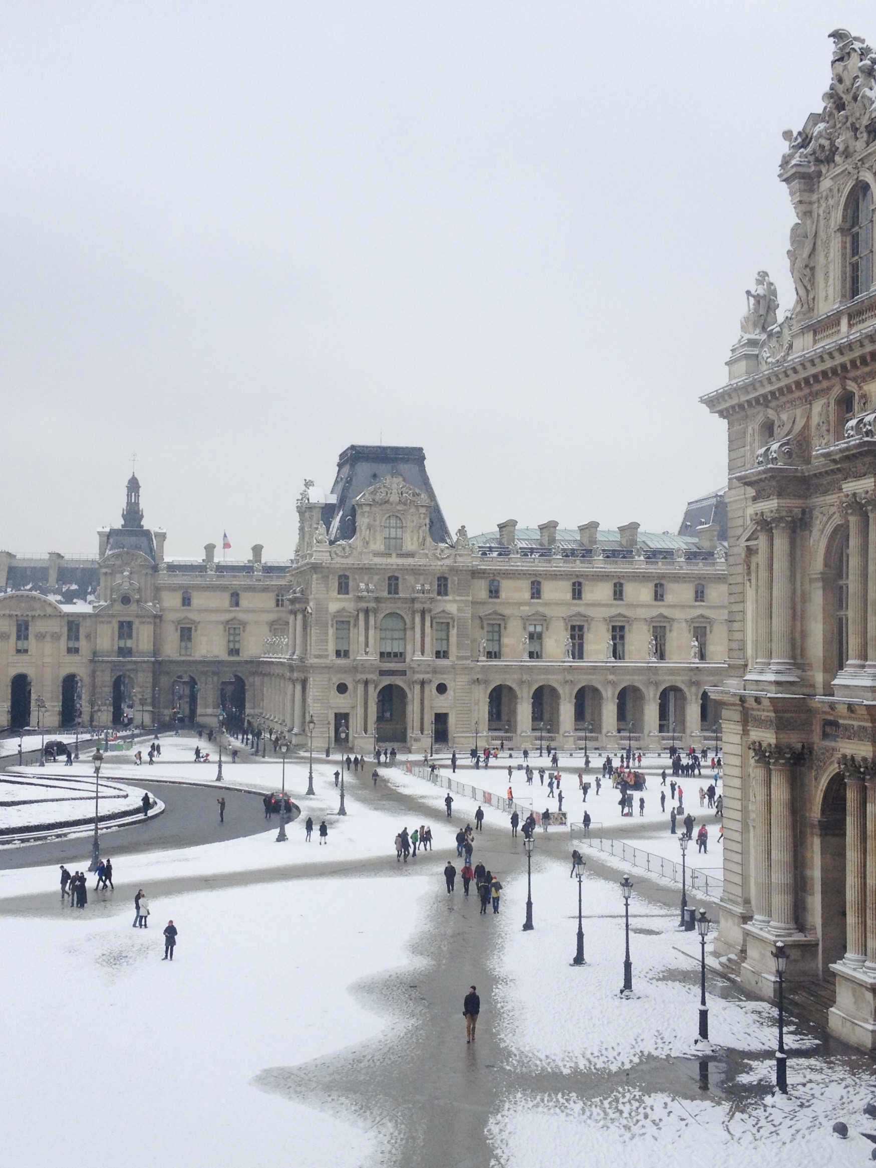 Snow at the Louvre Museum in a cold winter in Paris